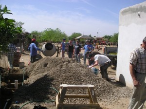 Construction ministry team pouring concrete for roof on Alberto's house!